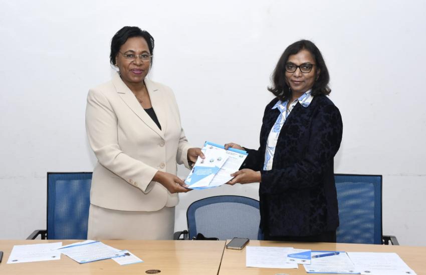 Prof Margaret Kobia presets WEE Hub publications to Dr. Kattamuri