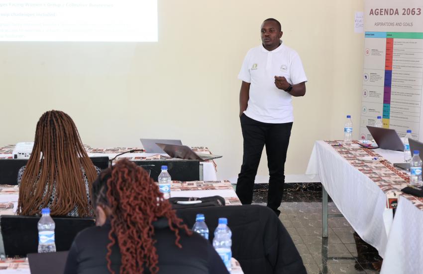 A member of the research team presents team findings