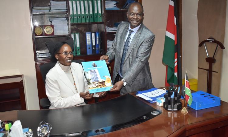 Prof. Mumenya poses for a photo with the outgoing  Dean, Prof. Ayub Gitau
