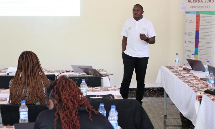 A member of the research team presents team findings