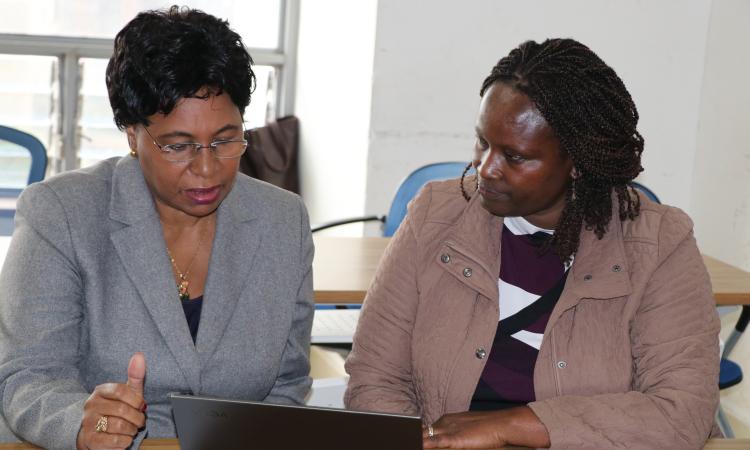 Prof Margaret Kobia and Ayoo Odicoh consult before official opening of the meeting