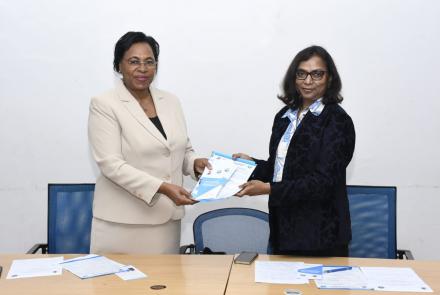 Prof Margaret Kobia presets WEE Hub publications to Dr. Kattamuri